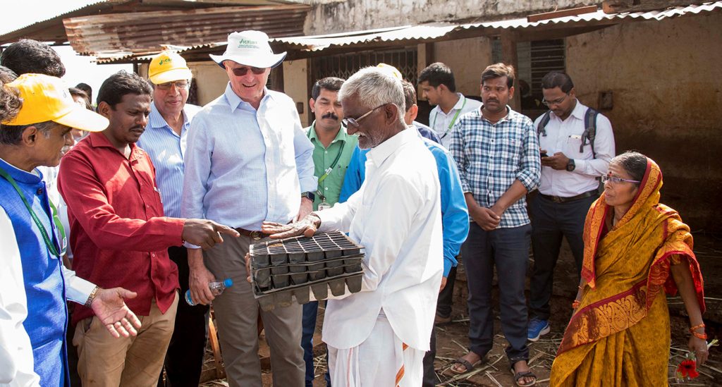 Farmer Bhimrao Mulgi (holding trays) interacts with the visitors. Photo: S Punna, ICRISAT